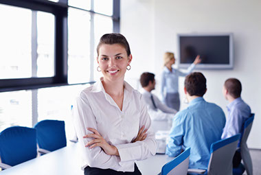Woman smiling in a boardroom